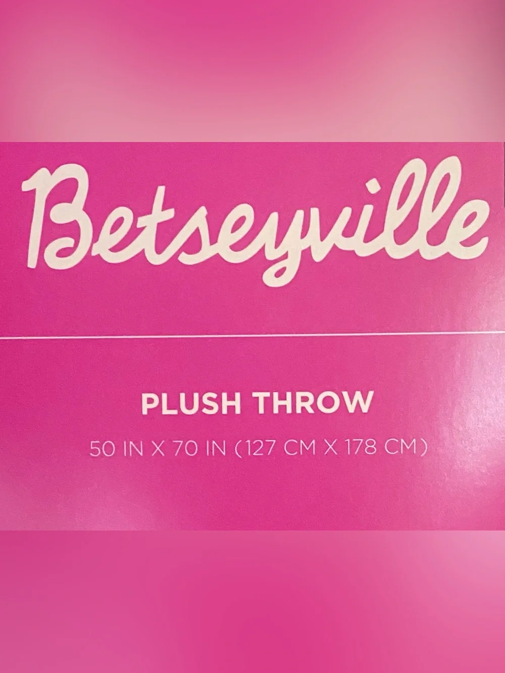 Betseyville plush throw pink bow heart pattern black background